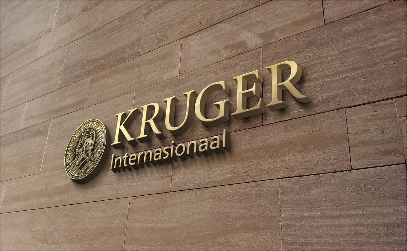 Kruger International signage in gold on a marble wall